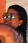 A picture of love symbol tattoo on Chrissy's back.
